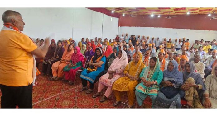 Former Minister and senior BJP leader, Choudhary Sukhnandan addressing a public meeting in Marh village on Monday