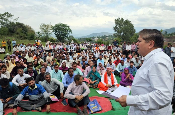 Rajiv Chuni addressing a gathering of PoJK displaced persons in Rajouri on Sunday.