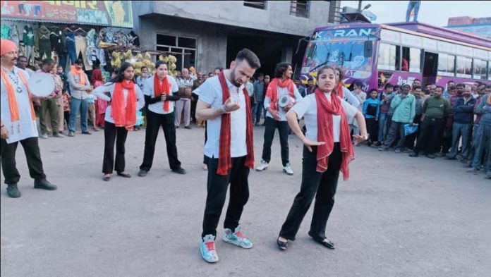 Artists staging street play ‘Matdaan’ in Udhampur.