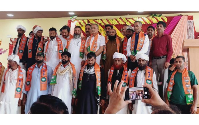 Former Dy CM, Kavinder Gupta posing with members of Gujjar community who joined the party at Jammu on Sunday.