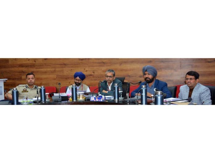 General and Police Observers chairing a meeting.