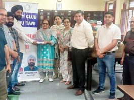 Members of Rotary Club Jammu Tawi presenting books to staff members of Government High Secondary School Nagrota.