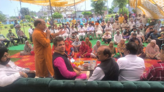 BJP president Ravinder Raina and other senior leaders at an election meeting at Ramgarh village on Tuesday.