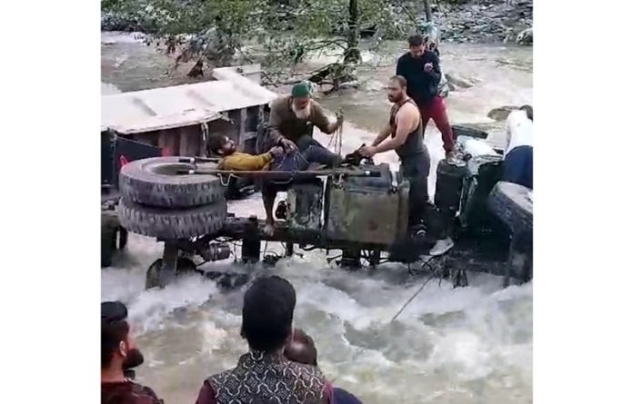 Remains of the Dumper which fell into Bisleri Nallah in Ramban on Tuesday. —Excelsior/Parvez Mir