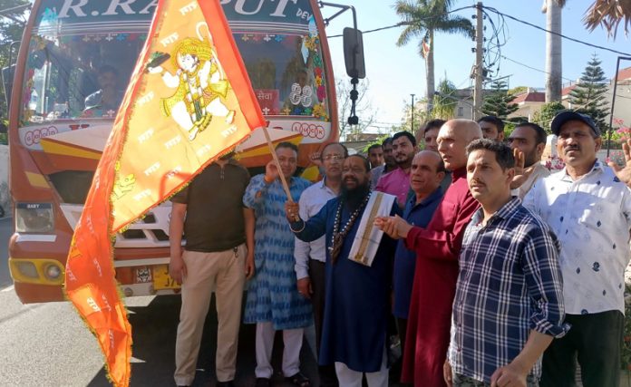 Raj Kumar Gupta flagging off bus to Haridwar from Jammu on Saturday.