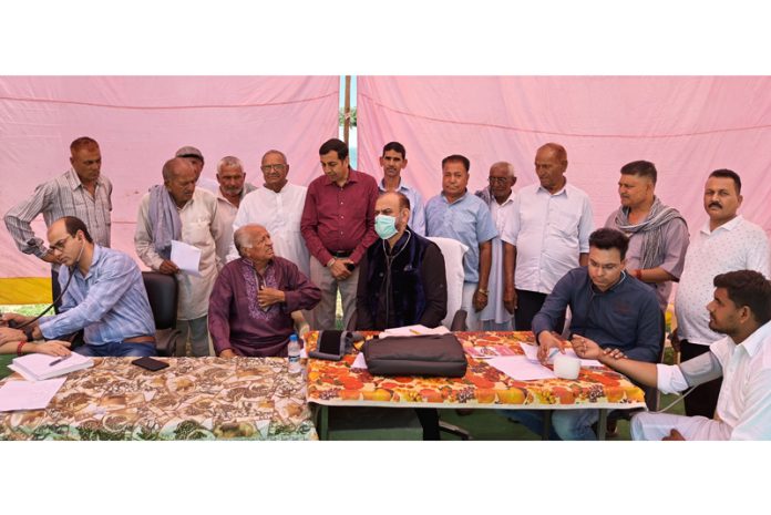 HoD Cardiology GMC & SSH Jammu Dr Sushil Sharma examining patients at Khojipur, Bishnah on Sunday.