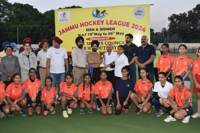 Transport Commissioner Rajender Singh Tara along with other dignitaries presenting winner's trophy to Hockey team in Jammu. Transport Commissioner Rajender Singh Tara along with other dignitaries presenting winner's trophy to Hockey team in Jammu.