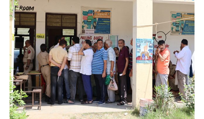 Kashmiri Pandits in a queue waiting to cast their vote at a Polling Booth at Chinore on Saturday. -Excelsior/Rakesh Kashmiri Pandits in a queue waiting to cast their vote at a Polling Booth at Chinore on Saturday. -Excelsior/Rakesh