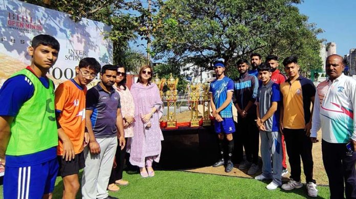School football team posing along with dignitaries in Jammu.