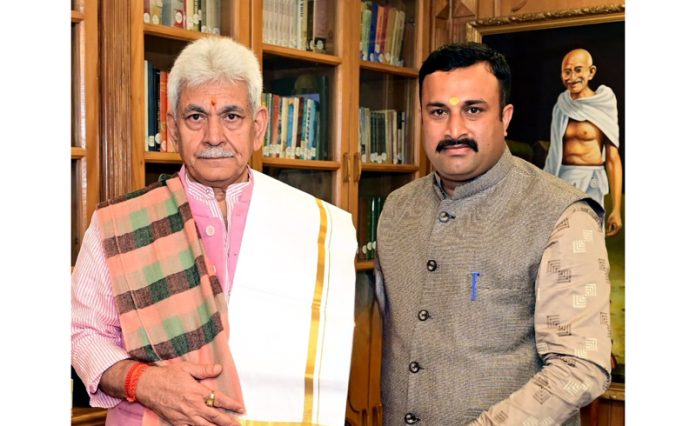 LG Manoj Sinha meeting with Mahant Rohit Shastri at Raj Bhawan on Sunday.