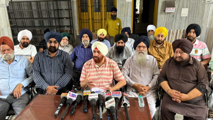 SUF chairman Sudershan Wazir addressing a press conference on Monday.