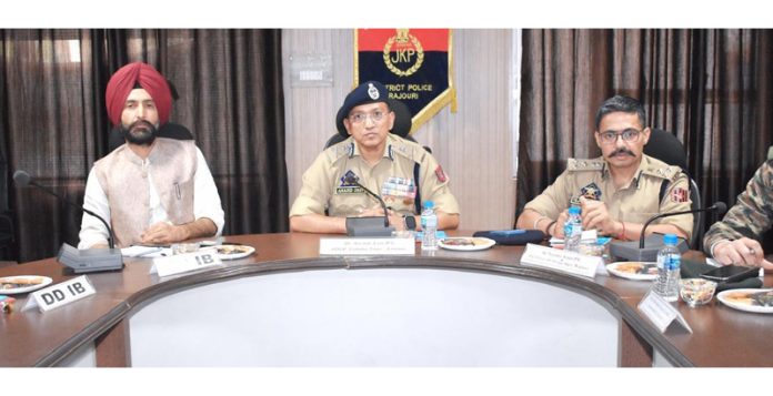ADGP Jammu Anand Jain chairing a meeting in Rajouri on Saturday.