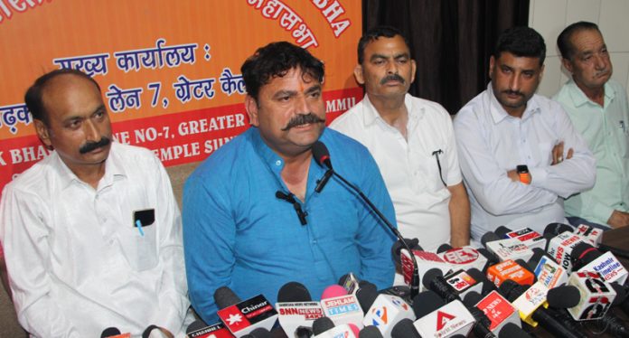 Rakesh Singh Charak, president All India Charak Biradari Mahasabha addressing press conference in Jammu. -Excelsior/ Rakesh