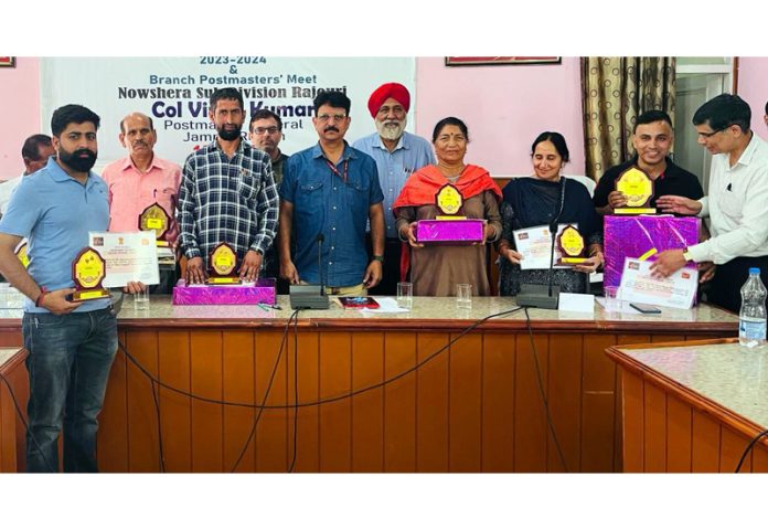 Col Vinod Kumar, PMG Jammu posing along with the best performers BPMs during a function on Wednesday.