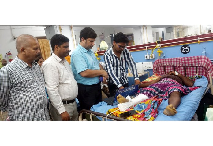 BJP leader, Puneet Mahajan taking on spot initiative to reactivate the Ayushman Card of a patient undergoing treatment at GMC, Jammu on Wednesday. BJP leader, Puneet Mahajan taking on spot initiative to reactivate the Ayushman Card of a patient undergoing treatment at GMC, Jammu on Wednesday.