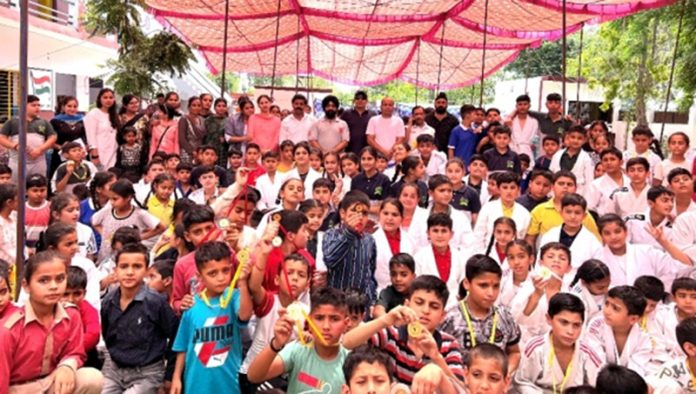 Judo Athletes posing along with dignitaries during closing ceremony at Jammu on Sunday.