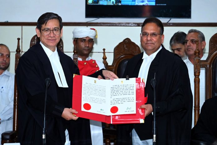 Chief Justice N Kotiswar Singh administering oath to Justice Wasim Sadiq Nargal.