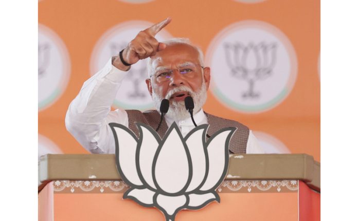 Prime Minister Narendra Modi addresses a public meeting in Ambala district on Saturday. (UNI)