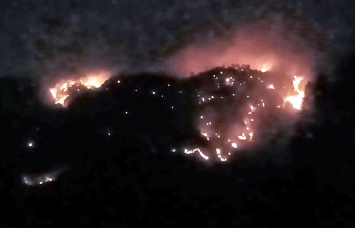 A view of fire in a forest range of Jammu region. A view of fire in a forest range of Jammu region.