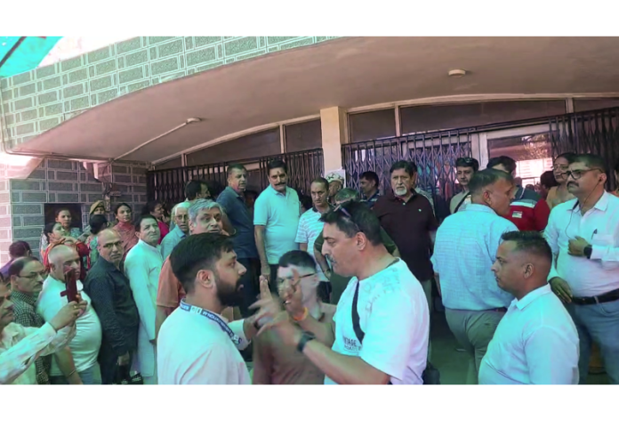 Kashmiri Pandit voters protest outside a Polling Station in Jammu on Monday.
