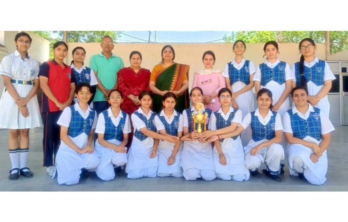 DPS girl's team displaying trophy along with school staff. DPS girl's team displaying trophy along with school staff.