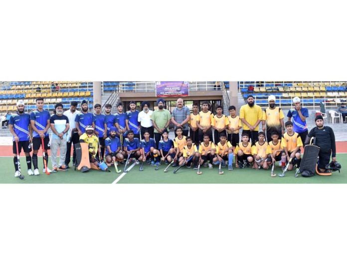 Participating players in six day Men Jammu Hockey League 2024 pose for a group photograph with others on Saturday. Participating players in six day Men Jammu Hockey League 2024 pose for a group photograph with others on Saturday.