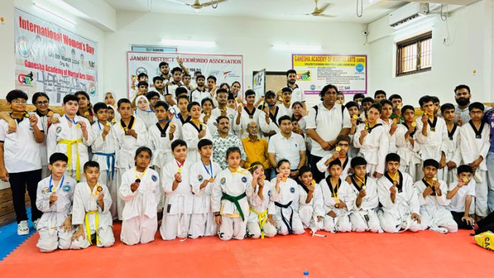 Taekwondo players posing along with dignitaries during an event at Jammu. Taekwondo players posing along with dignitaries during an event at Jammu.