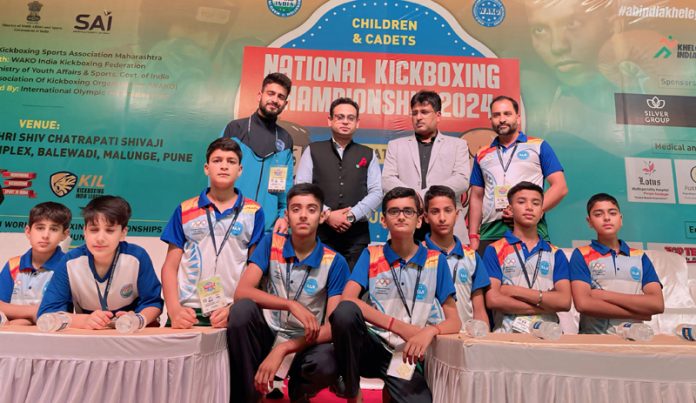 J&K Kickboxing team posing along with dignitaries.