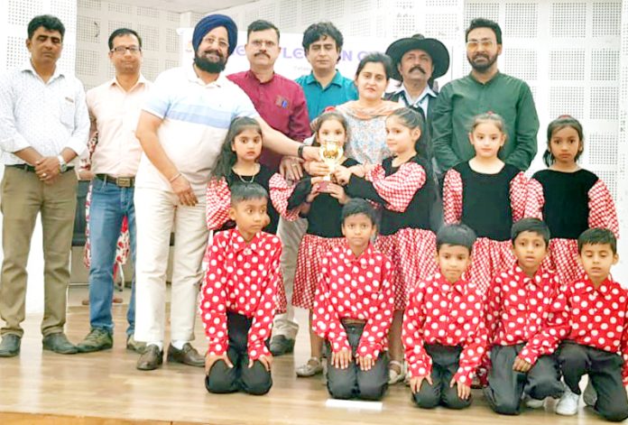 Dignitaries posing along with Toddlers and trophy. Dignitaries posing along with Toddlers and trophy.