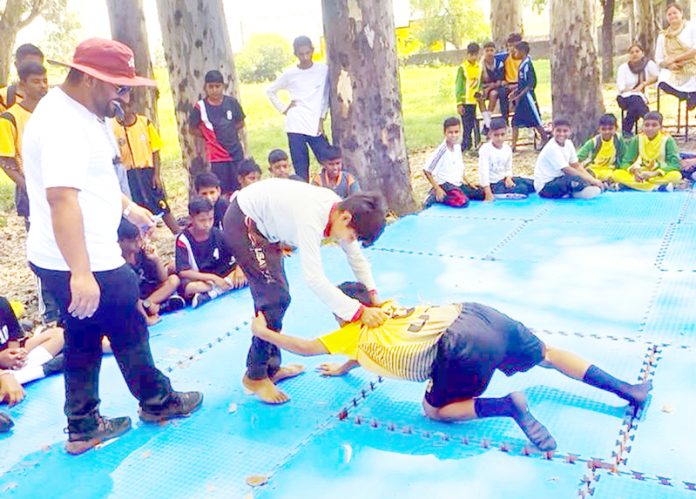 Players in action during a match on Wednesday. Players in action during a match on Wednesday.