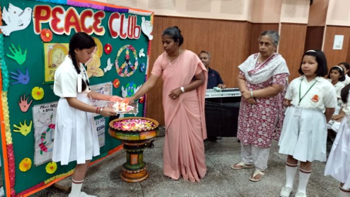 Principal, Amelina Rodrigues lighting lamp at School in a programme. Principal, Amelina Rodrigues lighting lamp at School in a programme.