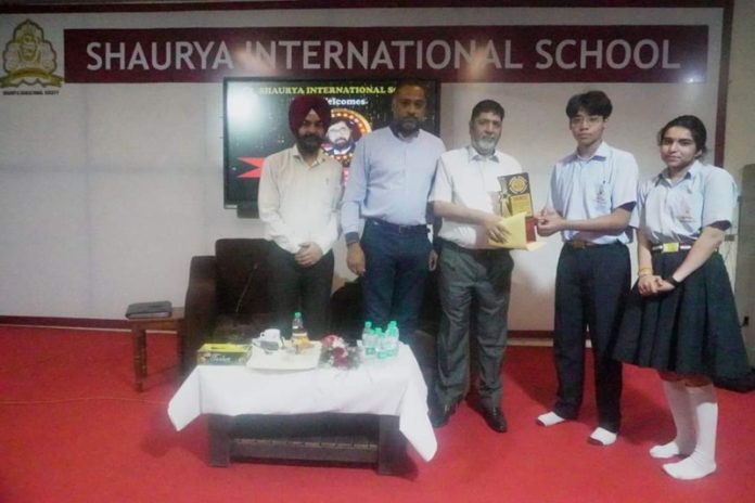 Senior Journalist Arun Joshi presenting award to students during a programme on Saturday. Senior Journalist Arun Joshi presenting award to students during a programme on Saturday.