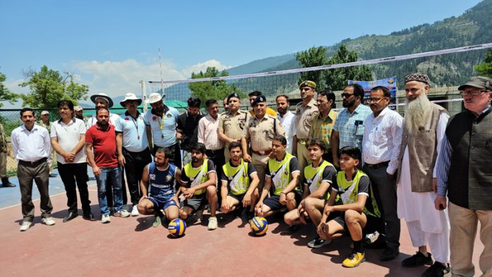 Additional Superintendent of Police (ASP), Bhaderwah Vinod Sharma posing along with young Volleyball players. -Excelsior/Tilak Raj
