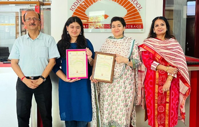 Jodhamal student AI Hana Babar posing with management of the School. Jodhamal student AI Hana Babar posing with management of the School.