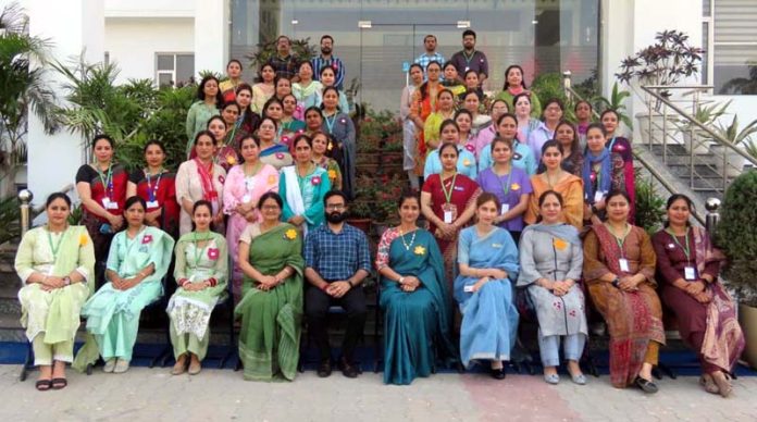 Teaching faculty of Jammu Sanskriti School Jammu posing for group photograph along with resources persons during workshop. 