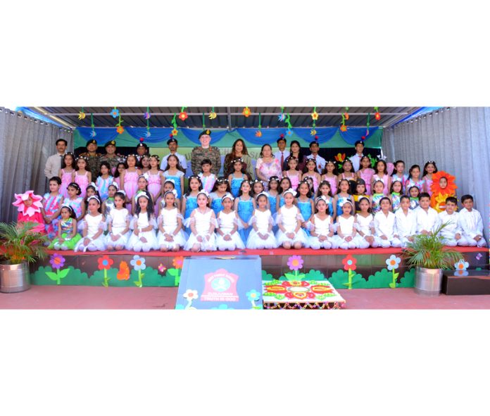 Toddlers posing along with dignitaries during the Annual Day event of APS Sunjuwan.