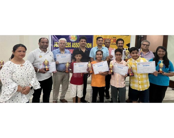 Young Chess players posing along with veterans and dignitaries at Jammu. Young Chess players posing along with veterans and dignitaries at Jammu.