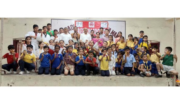 Medal winners posing along with dignitaries on Thursday.