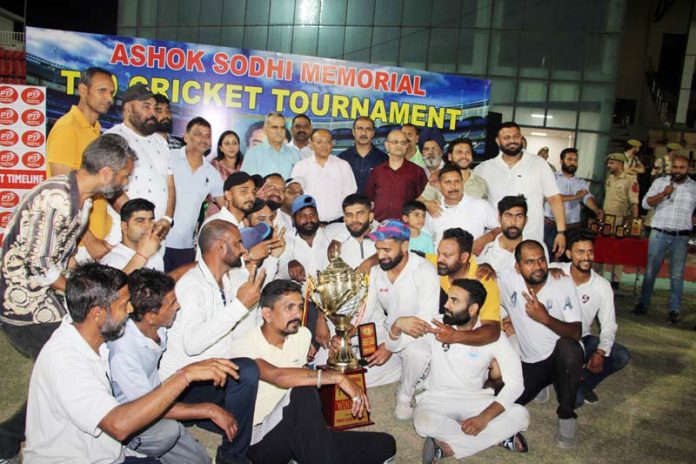 Dignitaries posing along with winners of Ashok Sodhi Memorial Cricket Tournament. -Excelsior/Rakesh