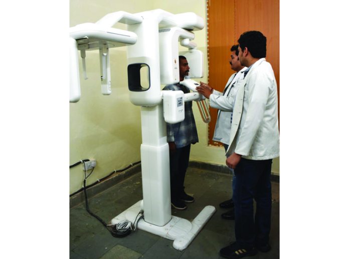 Technicians doing X-ray of a patient with newly installed CBCT Machine in Department of Dentistry, GMC Kathua.