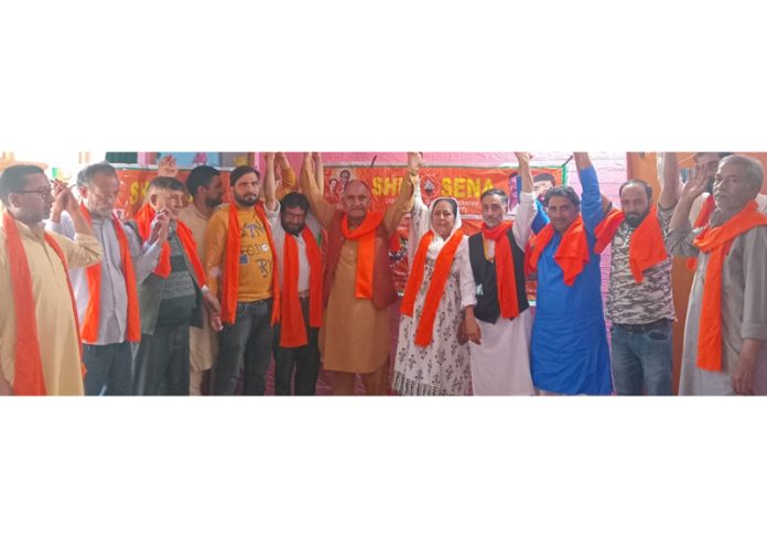 A group of people poseing for a photograph with others after joining Shiv Sena in Srinagar on Tuesday. A group of people poseing for a photograph with others after joining Shiv Sena in Srinagar on Tuesday.