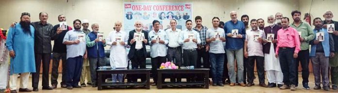 Dignitaries releasing a booklet at a convention of Low Paid Employees Federation in Doda on Sunday.