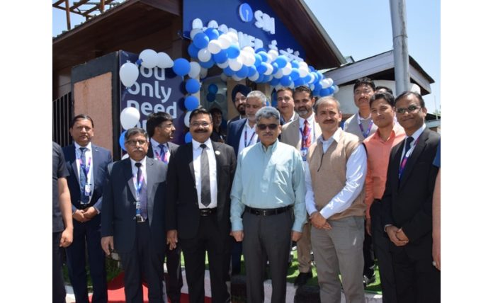 Chief Secretary, Atal Dulloo posing for a photograph after inaugurating SBI e-Corner on Tuesday.
