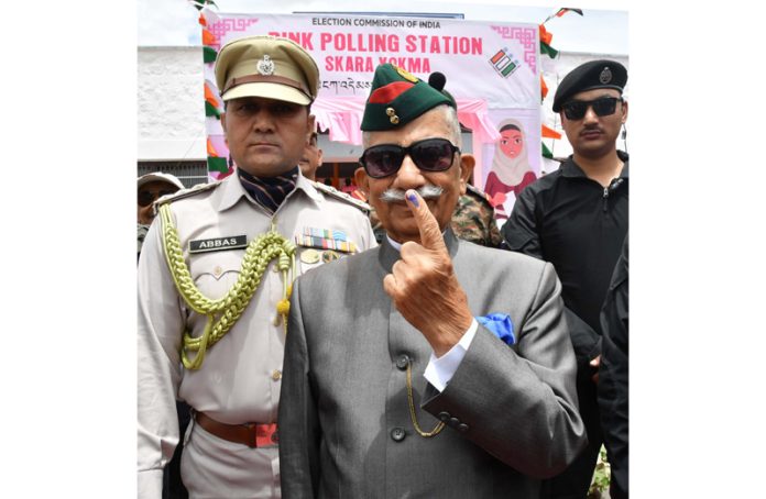 Lieutenant Governor of Ladakh, B.D. Mishra showing mark of indelible ink after casting his vote at a polling booth in Leh on Monday.