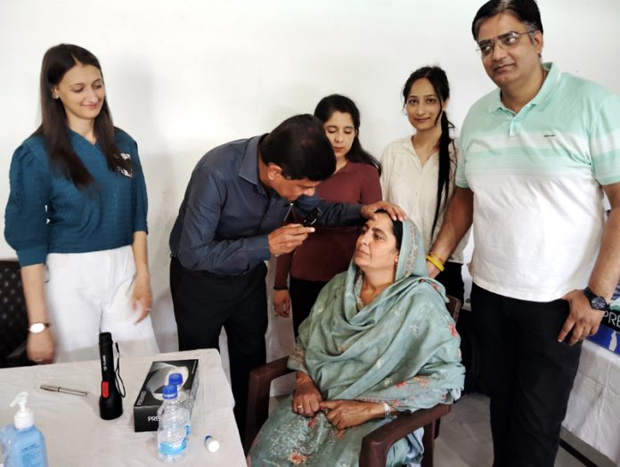 A doctor examines a patient during a medical camp in Bhaderwah on Sunday. -Excelsior/Tilak Raj A doctor examines a patient during a medical camp in Bhaderwah on Sunday. -Excelsior/Tilak Raj