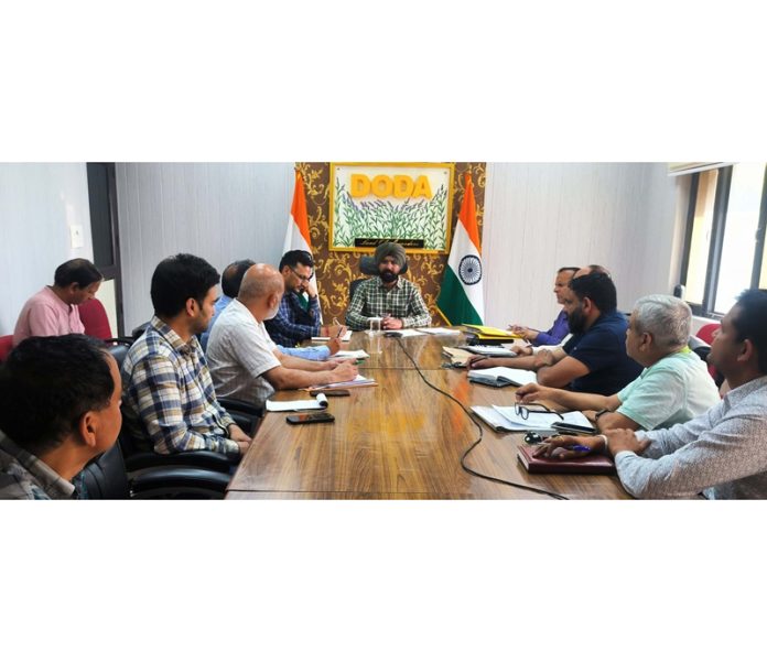 DC Doda Harvinder Singh chairing a meeting on Tuesday.