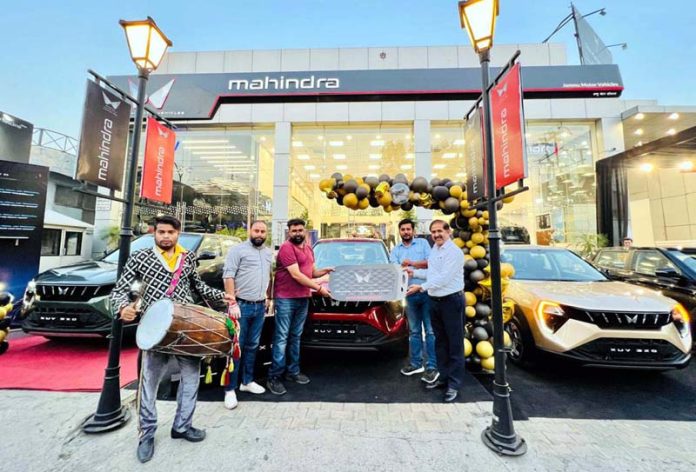 Jammu Motor Mahindra celebrating delivery of 10 brand new SUVs 3XO at their BC Road, Jammu showroom on Wednesday.