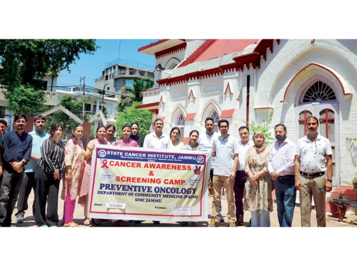 Doctors and staff of Preventive Oncology Unit of SCI Jammu posing together during a cancer screening camp at CNI Church, Jammu. Doctors and staff of Preventive Oncology Unit of SCI Jammu posing together during a cancer screening camp at CNI Church, Jammu.