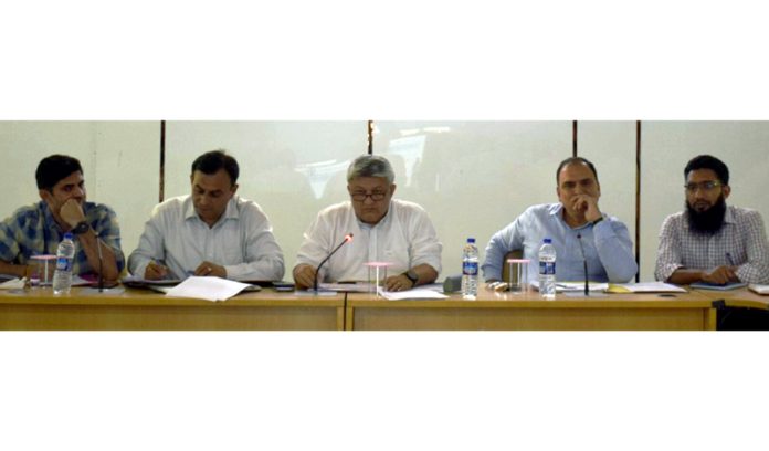 DC Reasi, Vishesh Mahajan chairing a meeting on Sunday.