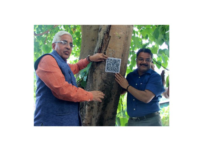 JU Vice-Chancellor displaying the QR Code installed on a campus tree. —Excelsior/Rakesh JU Vice-Chancellor displaying the QR Code installed on a campus tree. —Excelsior/Rakesh